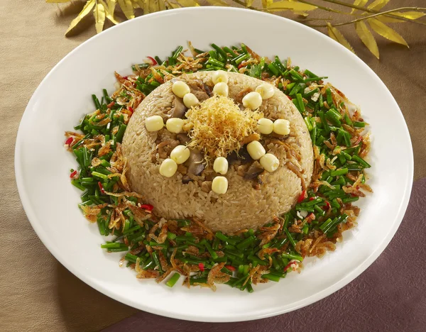 Shrimp lotus seed cakes on fried rice with saued onion on whit — Stok Foto
