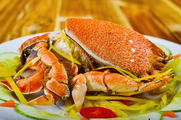 Steamed king crab on white plate in restaurant Royalty Free Stock Images