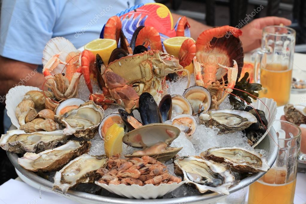 Seafood buffet with fresh oysters, clams, crabs, shrimps, snails