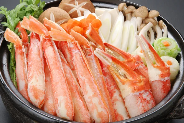 Raw fresh snow crab pot set with claws, legs, mushroom and — стоковое фото