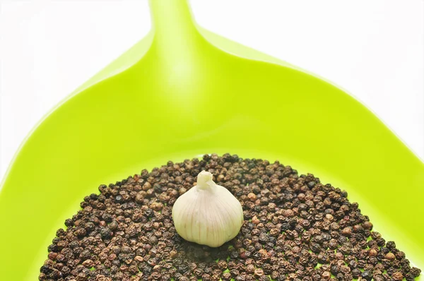 Peppers and garlic in the kitchen on a white background — Stock Photo, Image