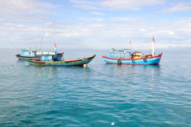 Quang Ngai, Vietnam - July 5, 2012: Fishing boats are mooring together in the sea