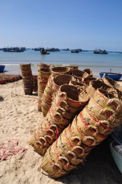 Lagi, Vietnam - February 26, 2012: Baskets used for transporting fishes from the boat to the truck are on the beach after working