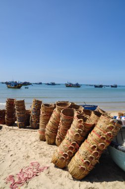 Lagi, Vietnam - February 26, 2012: Baskets used for transporting fishes from the boat to the truck are on the beach after working