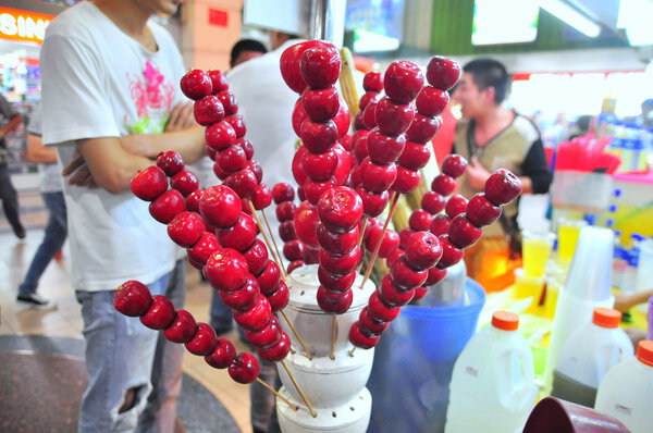 China Town, Singapore - November 15, 2014:  Traditional Chinese candy, called bingtang are for sale o the street