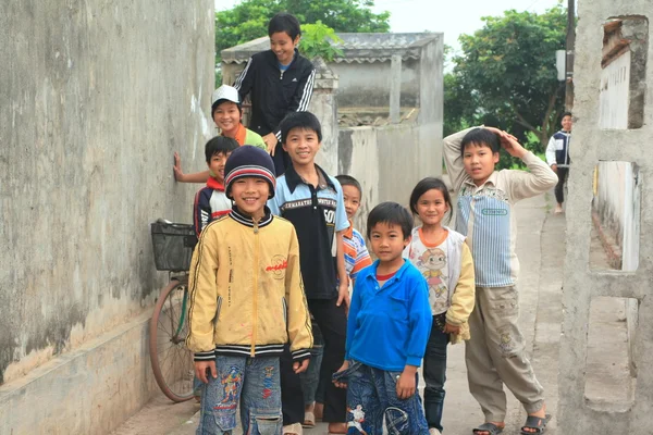 Nam Dinh, Vietnam - March 28, 2010: Children are playing in a village in the countryside in the North of Vietnam