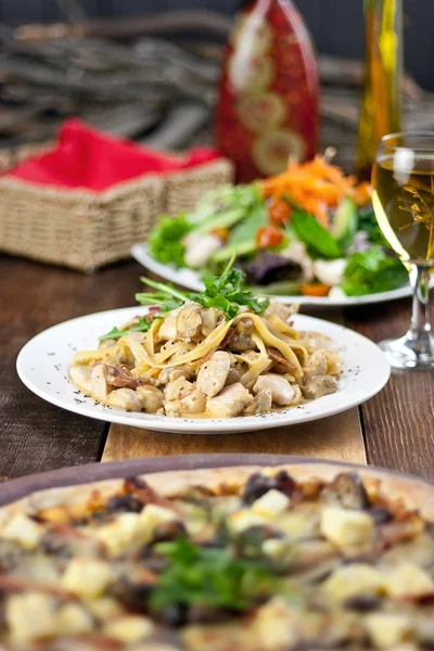 Restaurant Meal of Pizza, Pasta, Salad and Drink — Stock Photo, Image