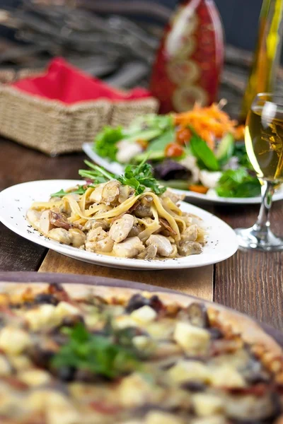 Restaurant Meal of Pizza, Pasta, Salad and Drink