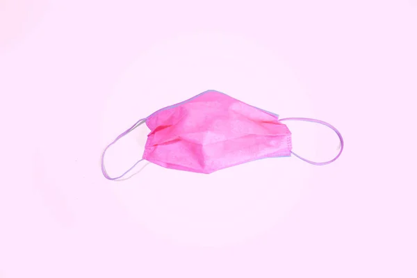 粉红背衬上的面罩 — 图库照片