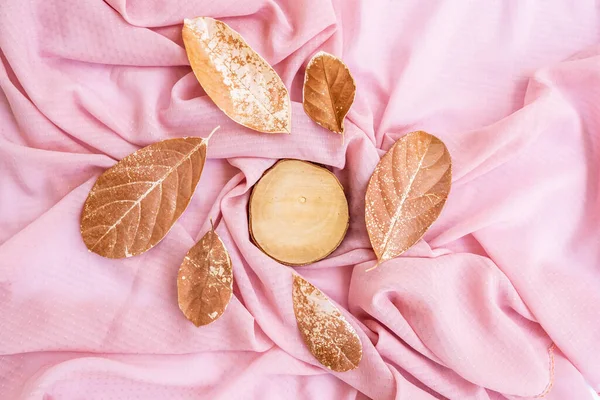 Minimalist Concept. dry leaves On Brown Scarf Background.Autumn, autumn concept. Flat lay, top view, copy spac