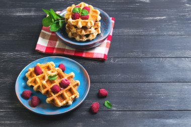 Belgian lush round waffles with fresh raspberries