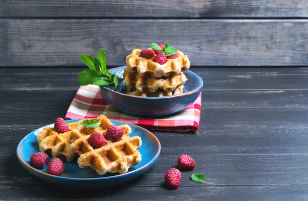 Belgian lush round waffles with fresh raspberries — стокове фото