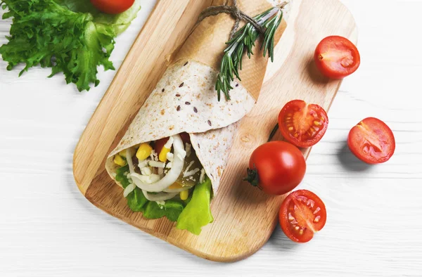 Burrito wrapped in tortilla bread — Stock Photo, Image