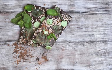 Chocolate, hand-made with mint leaves, candied violets, lemon ca