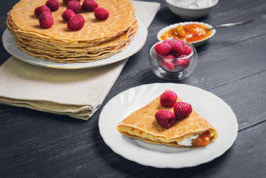 stack of pancakes on a white porcelain plate