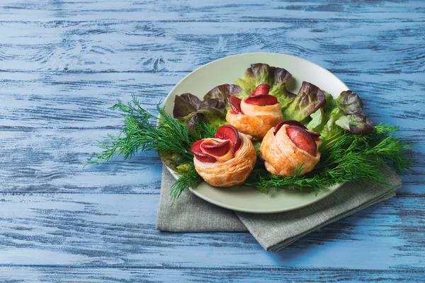 Buns puff with sausage in the form of flower buds of roses — Stock Photo, Image