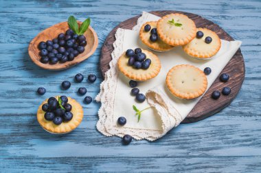 Closed berry tartlets baskets Cake with berries 