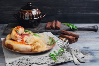 Sauerkraut with fried Munich sausages