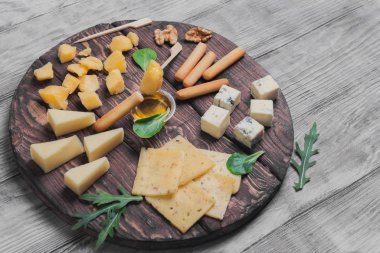 Assorted assortment of sliced cheeses