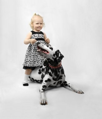 Happy little girl with dog clipart