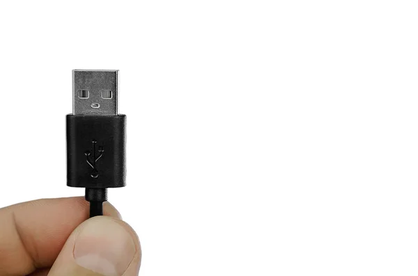 Fechar a mão segurando cabo USB — Fotografia de Stock