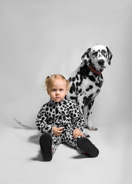 Little girl and Dalmatian dog — Stock Photo, Image