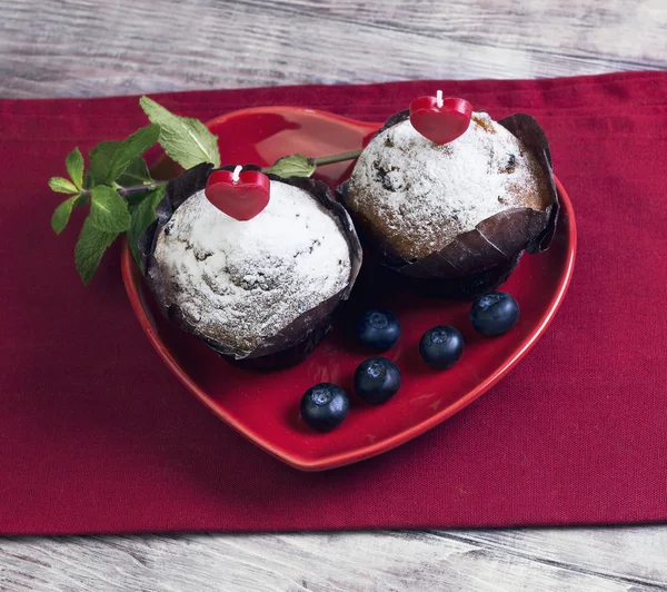 Heart with two berry muffins Royalty Free Stock Images