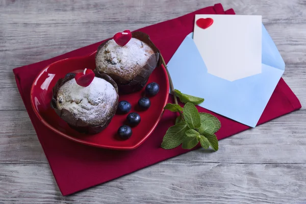Heart with two berry muffins Royalty Free Stock Photos