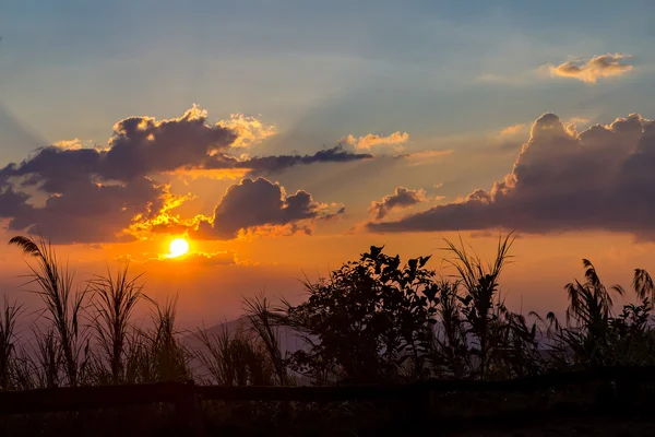 Clouds and sky with sun ray silhouetted on evening — Stock Photo, Image