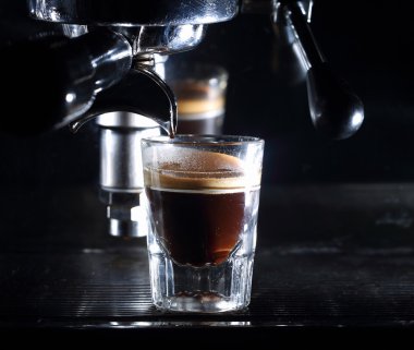 Espresso machine brewing a coffee clipart