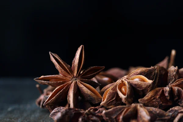 Anise star macro. Plant, agriculture, spice. Ingredient for aniseed alcohol: raki, ouzo, arak, sambuka. Natural, organic flavor badian closeup