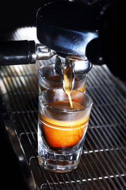 Espresso machine brewing a coffee clipart