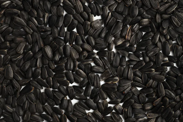 Black sunflower seeds close-up. Background — Stock Photo, Image