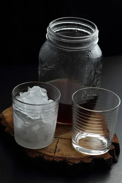 Filter coffee in glasses of hot and cold on a wooden board on dark background with copy space. — Stock Photo, Image