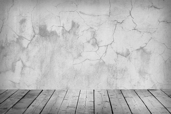 Room with a concrete wall and wooden floors. — Stock Photo, Image