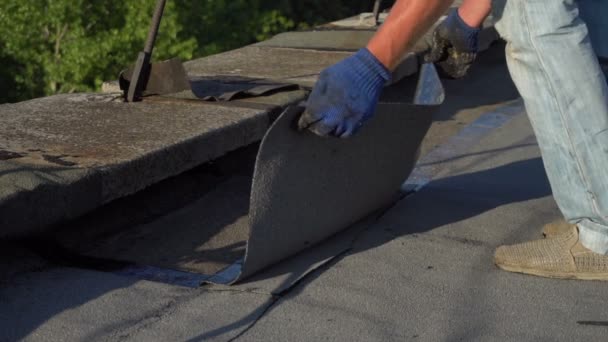 Roofer melts the bitumen — Stock Footage Roofer melts the bitumen Stock Footage