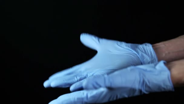 The doctor corrects gloves — Stock Video