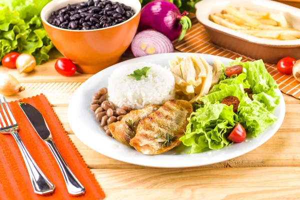 Grilled meat, rice and beans. — Stock Photo, Image