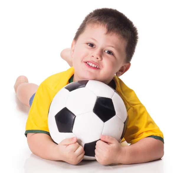 Junge mit Fußballball im Fußballtrikot — Stockfoto