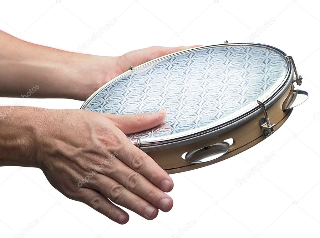 Tambourine in human hands