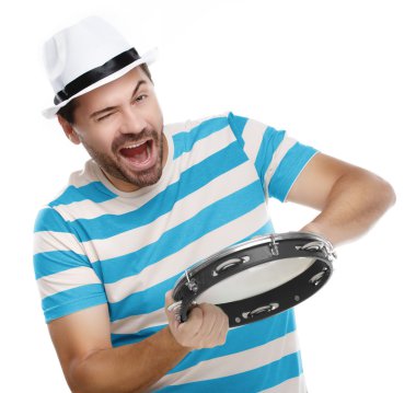 Happy man in colorful shirt with tambourine clipart