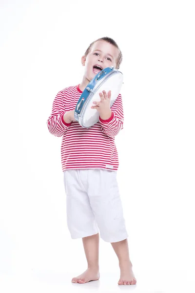 Happy boy in colorful shirt with tambourine — Stock Photo, Image