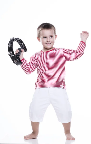 Happy boy in colorful shirt with tambourine — Stock Photo, Image