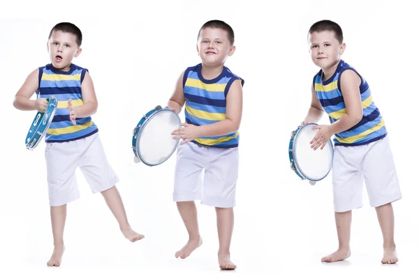 Happy boy in colorful shirt with tambourine — Stock Photo, Image