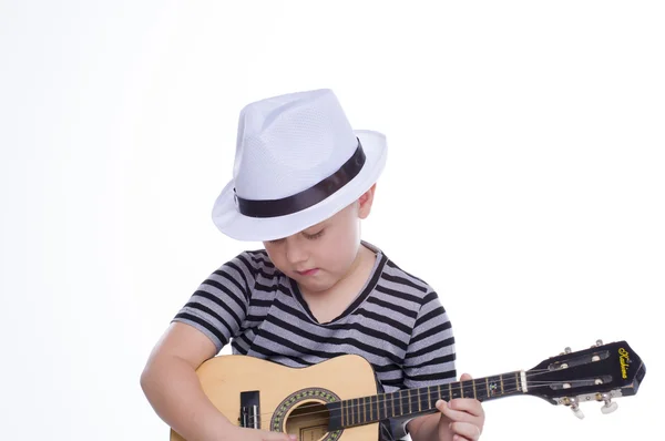 Small boy in hat playing on guitar — Stock Photo, Image