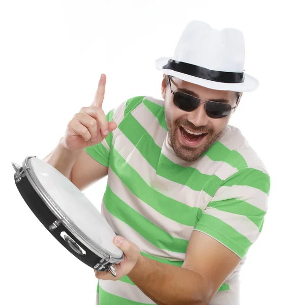 Man in colorful shirt and glasses with tambourine — Stock Photo, Image