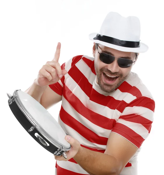 Man in colorful shirt and glasses with tambourine — Stock Photo, Image