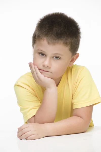 Sad child in thinking pose — Stock Photo, Image