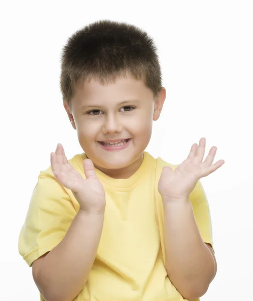 Niño pequeño con camisa amarilla haciendo gestos —  Fotos de Stock