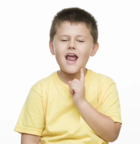 Lille dreng peger med en finger - Stock-foto